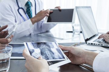 Female doctor has a X-ray photo