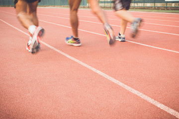Obraz premium Running track with blur of runner feet in stadium