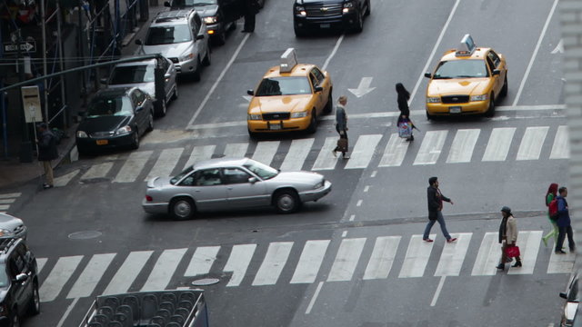Time lapse of traffic congestion and pedestrians on a busy New York street