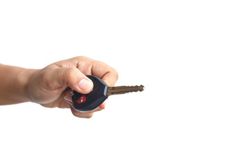 Hand holding car key