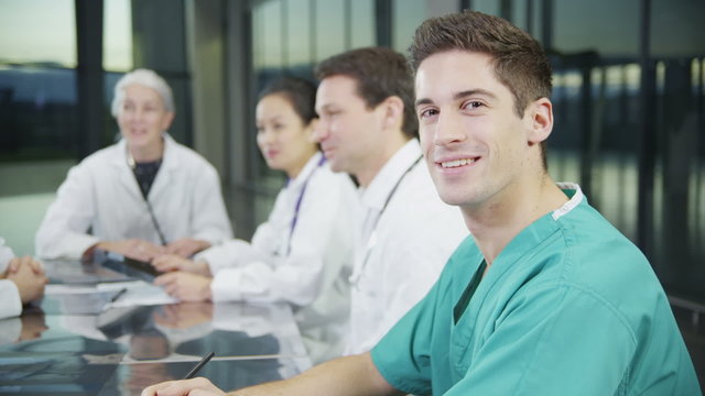 Portrait of a happy male medical worker in a meeting