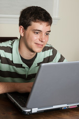 Teen boy on laptop