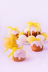 Decorated easter cakes and eggs  in yellow colors. Selective foc
