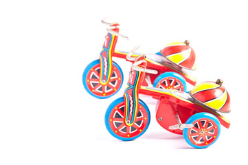 Fototapeta premium antique tin toy tricycle on white background