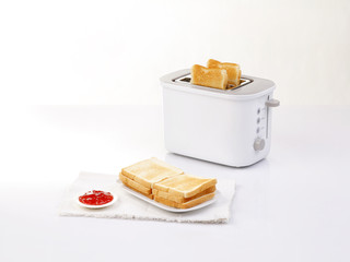 bread toaster and toasted bread © venusangel