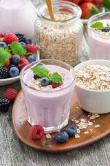 berry smoothie with oatmeal in a glass on table, vertical