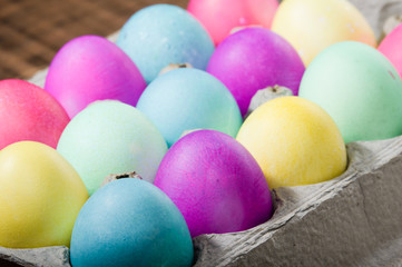 Egg carton of colorful dyed Easter eggs