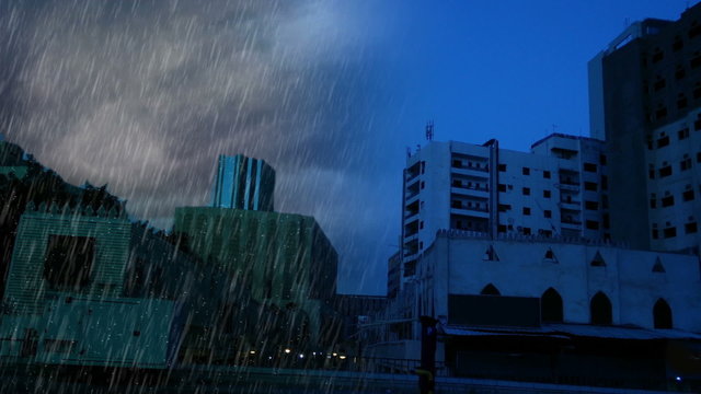 clear day and heavy rain over old maket under modren jeddah