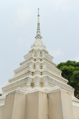 Fototapeta premium white stupa under the sun light at Wat Mai Pak Bang