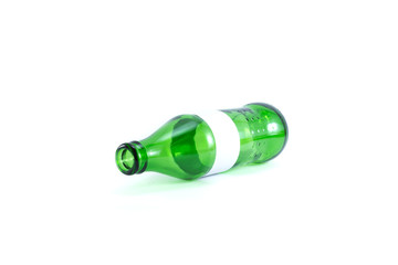 A green bottle with blank label reflective bottom isolated white