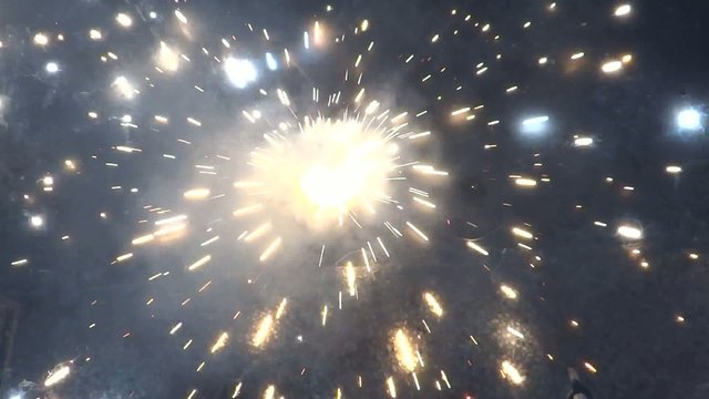Charkhi firecracker spinning on floor.