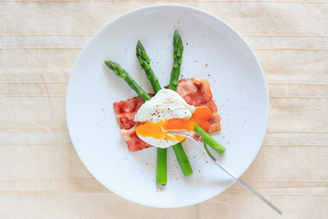 Poached egg on green asparagus