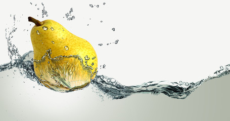 Ripe pear and splashes of water.