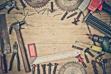 Fototapeta na wymiar Top view of a carpenter's wooden table with many types of tools