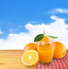 6474. Orange juice in glass with mint,  fresh fruits on wooden