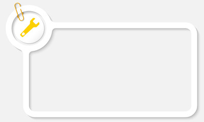 white frame for text and yellow spanner