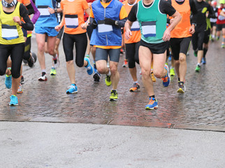 runners during marathon and it is raining