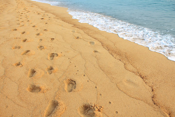 Footprints on the sand beach