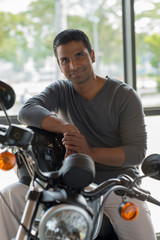 Fototapeta na wymiar Indian man on motorbike