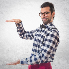 Posh boy holding something