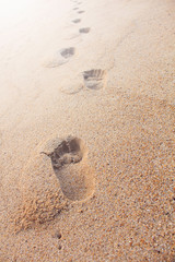 Footprints on the sand beach