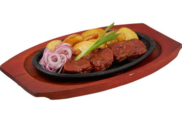 beef medallions in a pan on a wooden stand