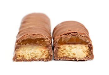 Two chocolate bars with caramel and cookie on a white.