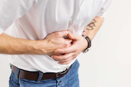 Young man having stomach pain