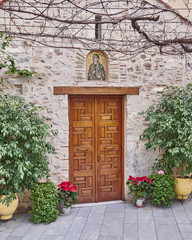 Fototapeta na wymiar Athens, Greece, Panaghia Chrysospiliotisa old church entrance