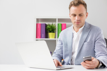 Young businessman in office