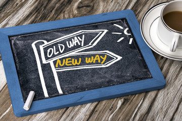 new way or old way signpost hand drawing on blackboard