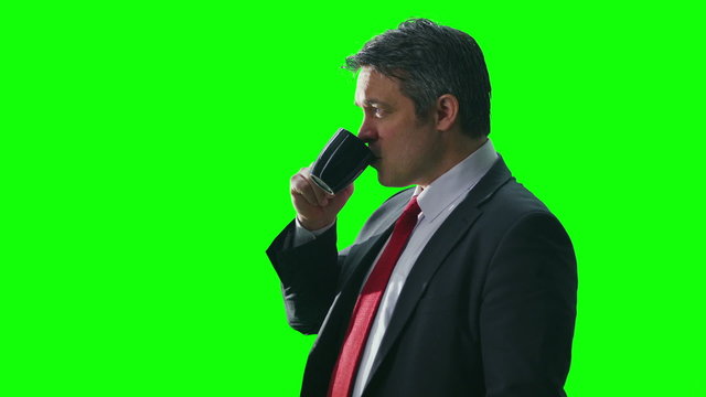 Portrait of attractive successful businessman on green screen background
