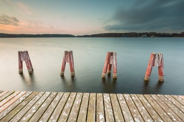 Lake landscape with jetty. Long time exposure