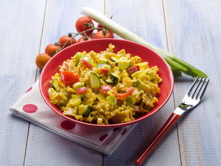 pasta with saffron cream sauce and sliced vegetables