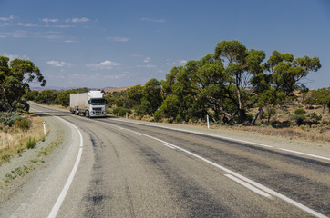 Naklejka premium Road train truck at rural intrestate highway
