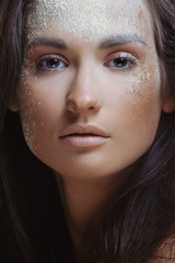 Fototapeta premium Young beautiful woman in nature makeup powder