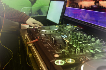 DJ playing music in the nightclub