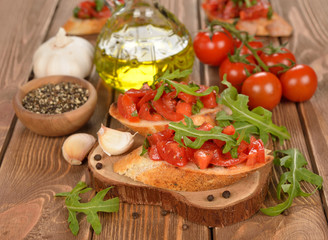 Bruschetta with tomatoes and arugula