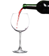 Red wine pouring on white background