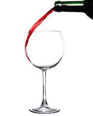 Red wine pouring on white background