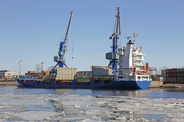 Fototapeta premium Cargo ship moored at the pier