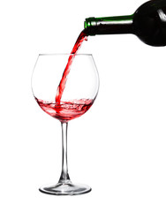 Fototapeta na wymiar Red wine pouring on white background
