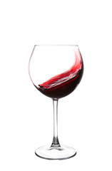 red wine swirling in a goblet wine glass