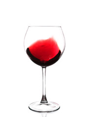 red wine swirling in a goblet wine glass,