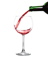 Red wine pouring on white background