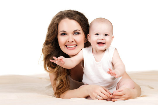 Portrait of happy mother with baby on a white background.