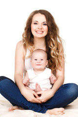 Portrait of happy mother with baby on a white background.