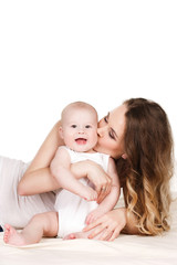 Obraz na płótnie Canvas Portrait of happy mother with baby on a white background.