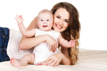 Portrait of happy mother with baby on a white background.