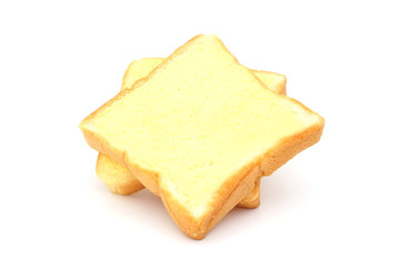 square bread with butter on white background